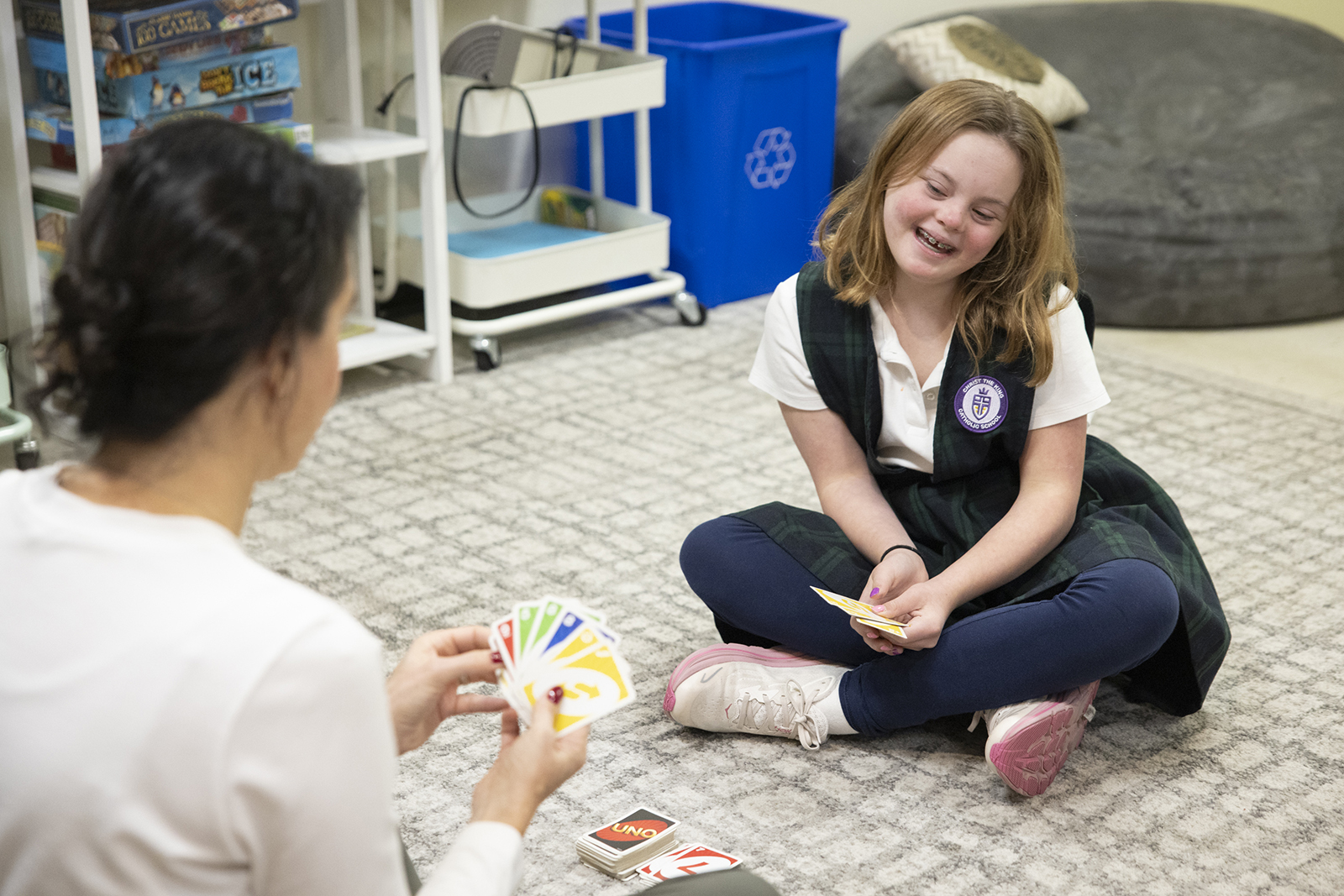 Students with special needs in Catholic schools
A student plays a game with an occupational therapist