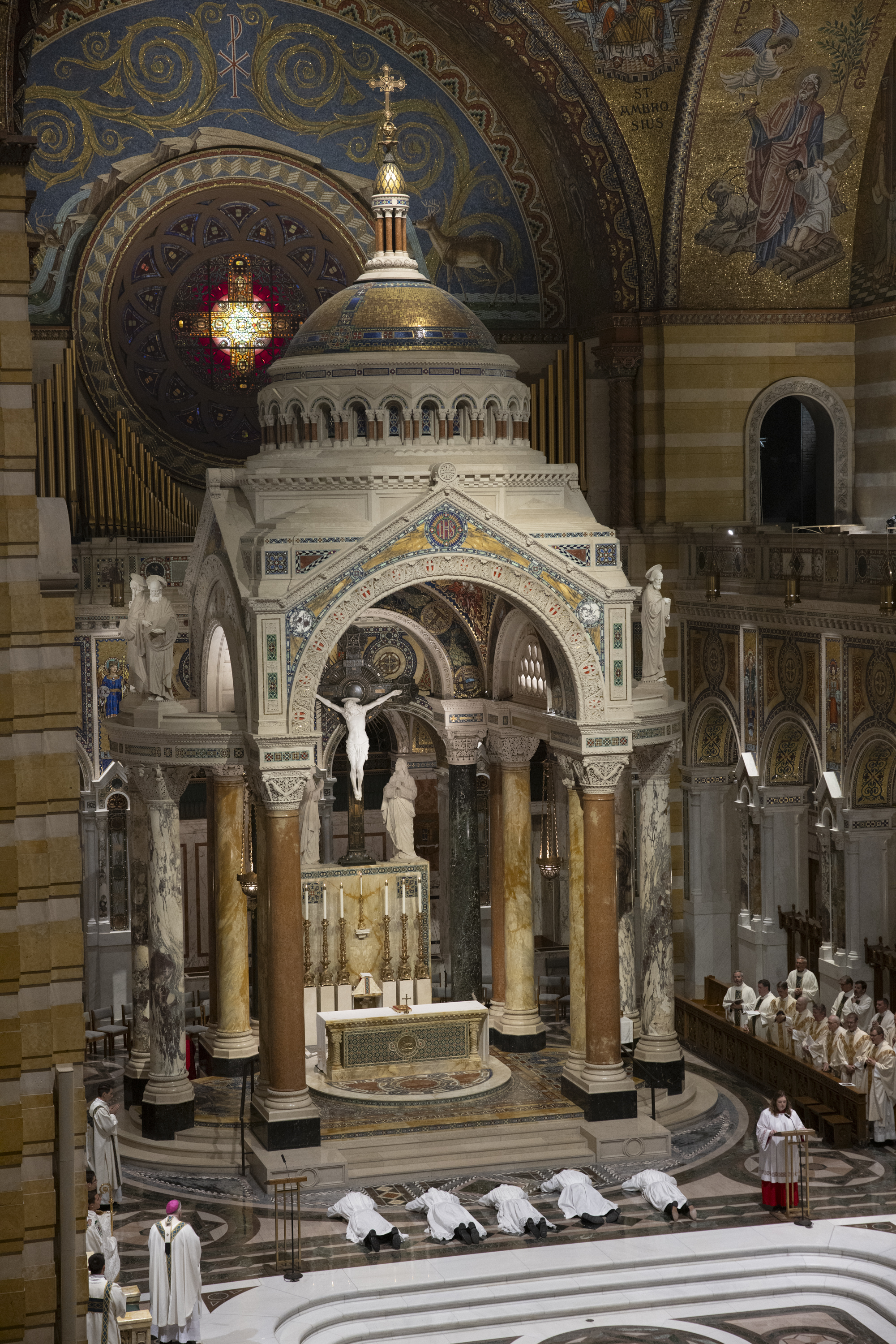 Five men lay prostrate during the litany of supplication during the rite of ordination of deacons, to become transitional deacons.