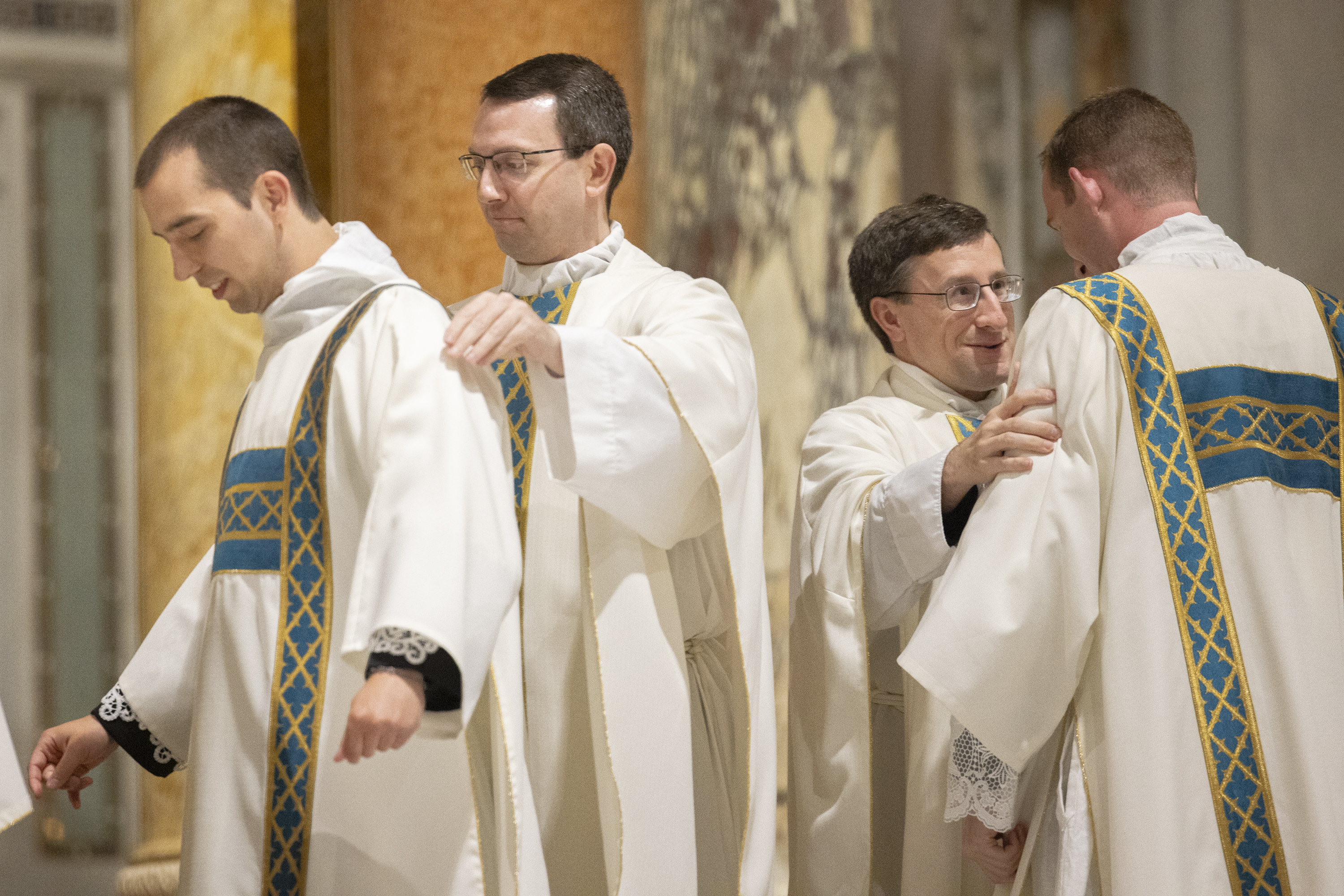 Deacon Mark Koenemann was vested by Father Jason Schumer and Deacon Curtis Prize was vested by Father Anthony Gerber during the rite of ordination of deacons.