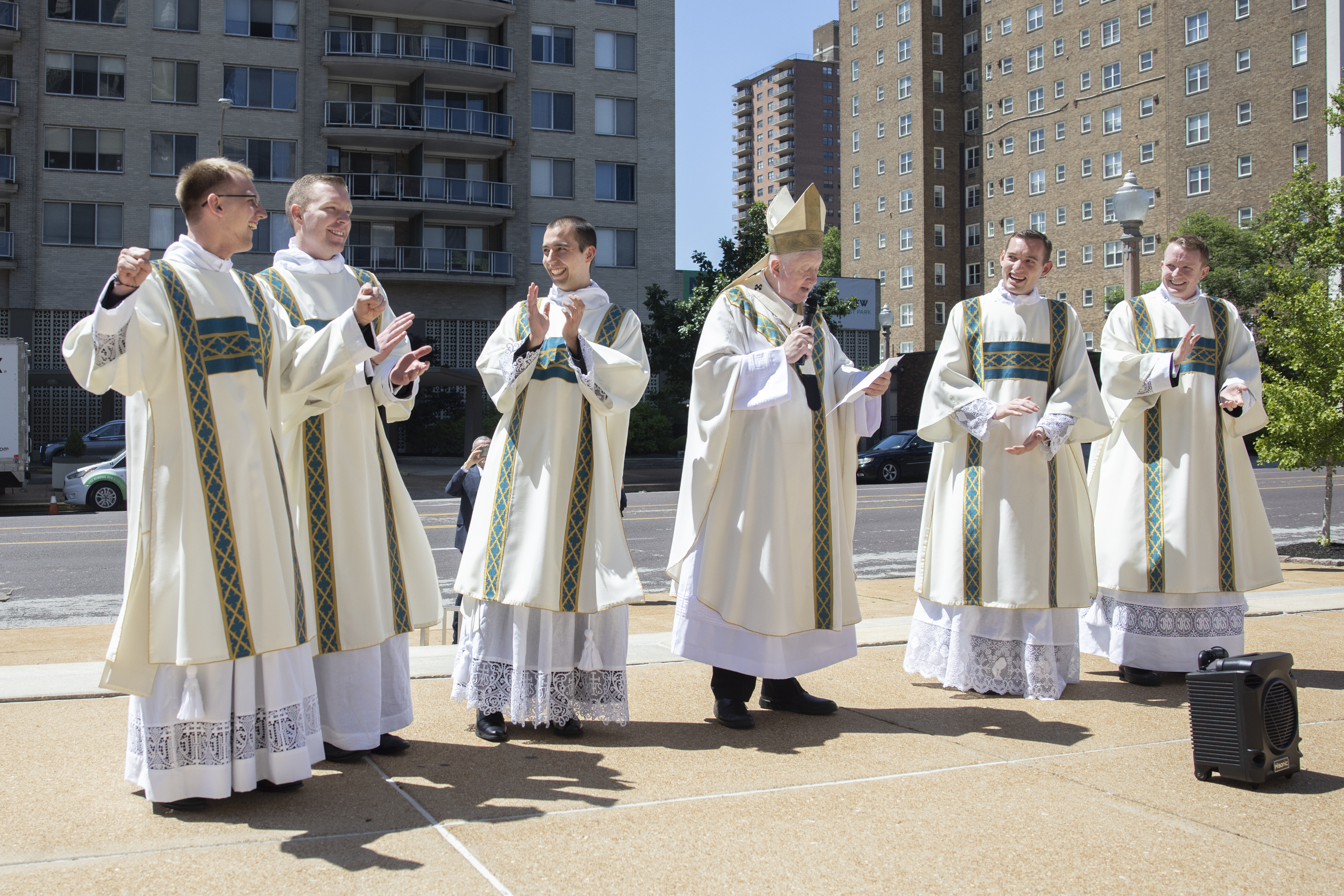 Archbishop Mitchell T. Rozanski read assignments for newly-ordained transitional deacons.