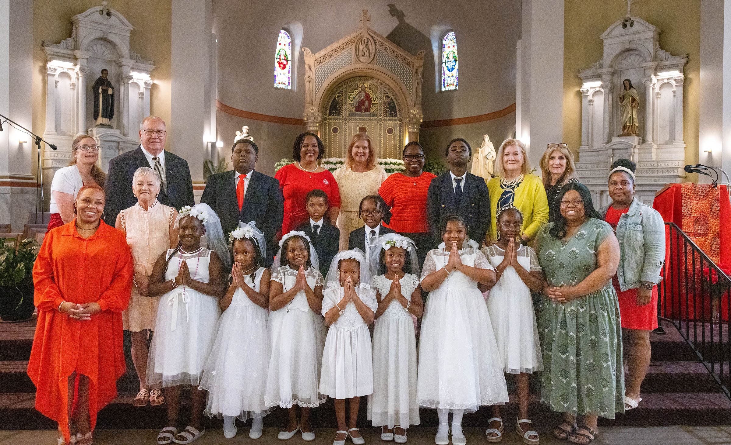 St. Louis Catholic Academy receives large group into the Church at Pentecost