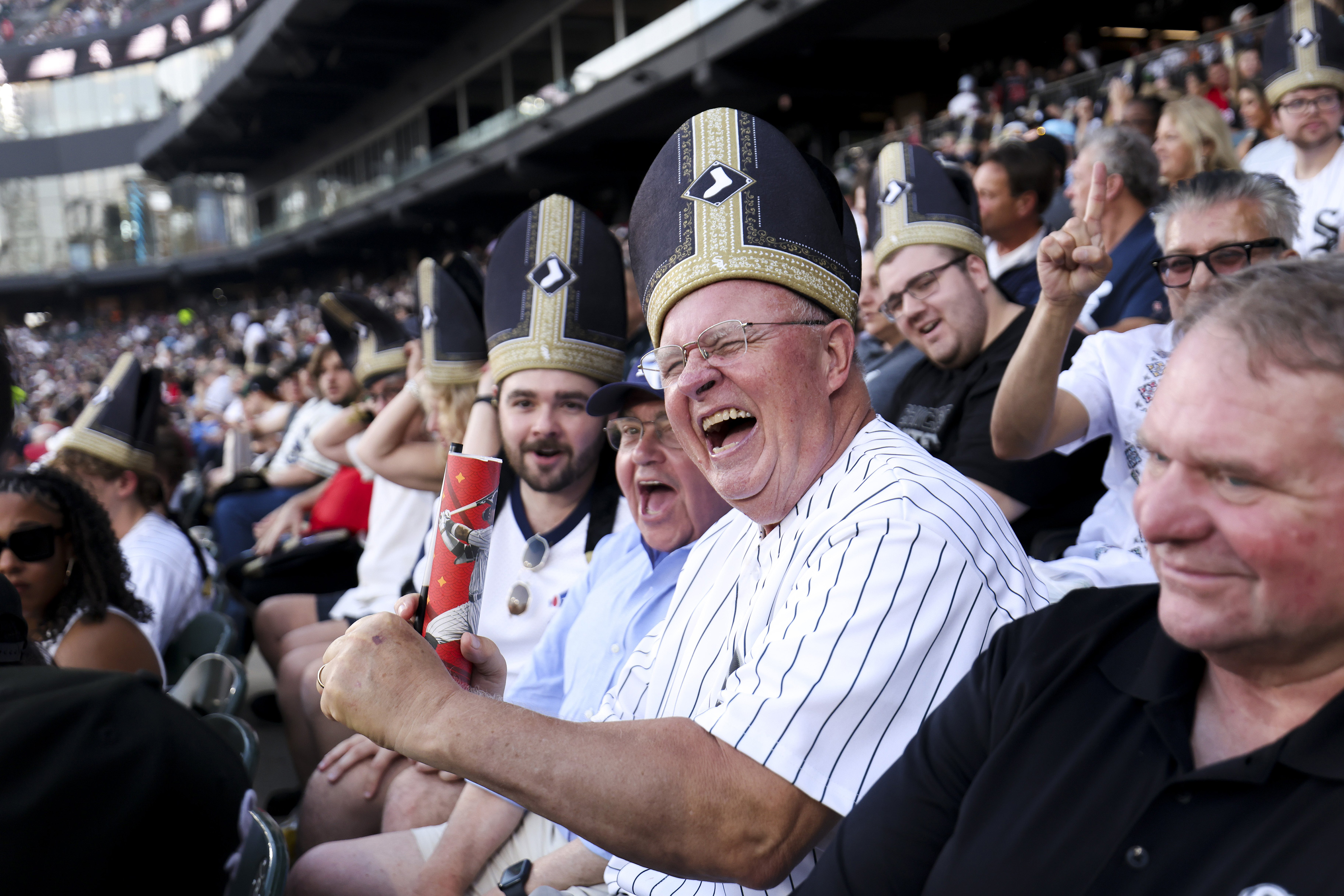 Fans celebrate Pope Leo XIV with custom White Sox mitre-style hat giveaway